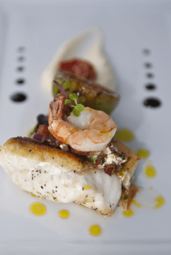 Pan-roasted market fish, cauliflower cream, chorizo salsa